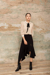 Asymmetric silk midi skirt with front slit and cascading ruffle hem detail